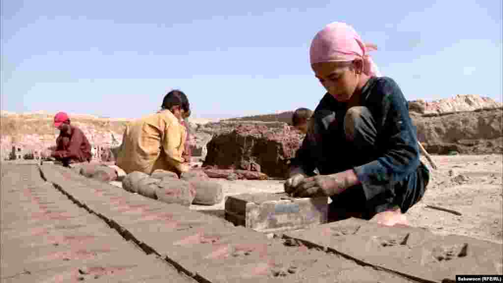 Hamida Khan, who is 8 years old, is one of the children working as a bonded laborer at the brick kiln in Nangarhar.