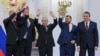 The Moscow-appointed heads of Ukraine's Kherson and Zaporizhzhya regions and separatist leaders from Donetsk and Luhansk celebrate with Russian President Vladimir Putin (center) after signing what the Kremlin calls "accession treaties" on September 30.