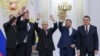 The Moscow-appointed heads (left to right) of the Kherson region, Vladimir Saldo, and Zaporizhzhya region, Yevgeny Balitsky, jRussian President Vladimir Putin, Donetsk separatist leader Denis Pushilin, and Luhansk separatist leader Leonid Pasechnik react after signing treaties formally annexing the regions in Moscow on September 30.