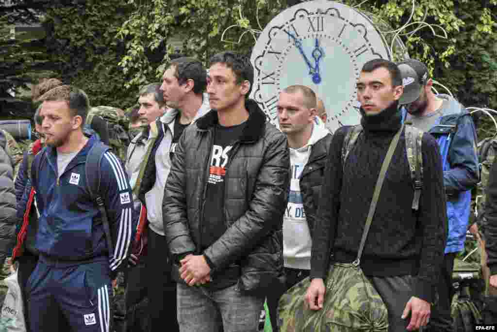 Draftees attend a farewell ceremony outside a recruiting office in Bataisk.