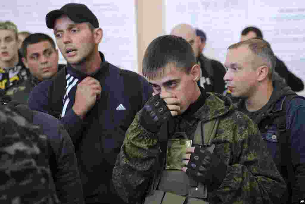 Russian recruits gather inside a military processing center in Bataisk, in southern Russia&#39;s Rostov-on-Don region on September 26. A recent Ukrainian counteroffensive swept Russian forces out of most of the Kharkiv region, with reports of heavy losses of soldiers and weapons.