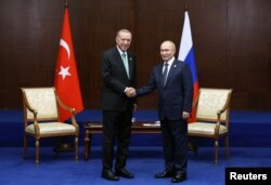 Recep Tayyip Erdoğan și Vladimir Putin în Astana, Kazakstan, 13 octombrie. Este a doua întâlnire a celor doi în mai puțin de o lună.