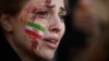 A demonstrator attends a rally in support of the Iranian protests in Paris on October 9.