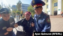 KDP activists are detained by police in Almaty on October 6.