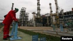 A man works at PKN Orlen's main oil refinery in Plock, Poland.