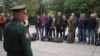 A Russian serviceman addresses reservists at a gathering point during an ongoing partial mobilization of troops, which was announced on September 21. 