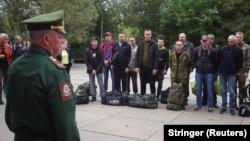 A Russian soldier addresses reservists during the partial mobilization of troops in the town of Volzhsky in Russia's Volgograd region on September 28.