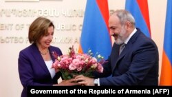 ARMENIA - U.S. House Speaker Nancy Pelosi accepts a bouquet of flowers from Armenian Prime Minister Nikol Pashinian in Yerevan, September 18, 2022,