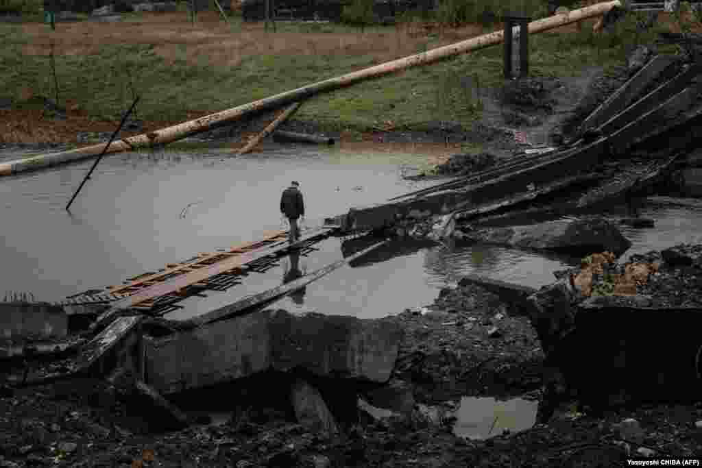 While some agree to leave, others are still resolute. &quot;Whatever happens, happens. I go to bed and I sleep. I don&#39;t hide in the basement. My neighbor&#39;s place was hit by shelling. The guesthouse, the closet, the terrace,&quot; said a 66-year-old man named Gennady as he crossed over a destroyed bridge.