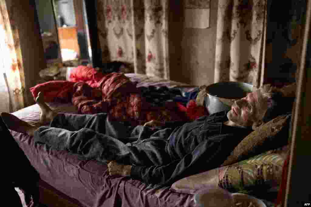 Another trapped resident is Mykola Pylypenko, 66, a former furniture factory worker who was diagnosed with lung cancer five months ago. With his children and grandchildren having fled, he is cared for by his wife, Oleksandra, 67, who tends to his every need.