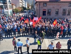 Protesters waved Macedonian flags and shouted "Fascists!" and "Murderers!" at club officials.