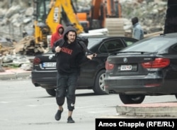 Erik, a Russian citizen, photographed after crossing into Georgia. He told RFE/RL that locals and police were demanding bribes on the other side of the border.