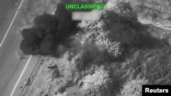 Explosions at an unknown location in Iran are shown in a photo released by US Central Command from the latest wave of attacks.
