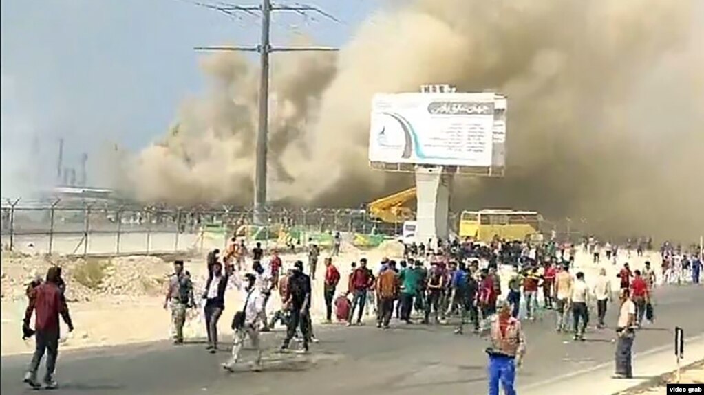 Petrochemical workers in Bushehr take part in an anti-government protest on October 10. 