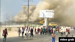 Petrochemical workers in Bushehr take part in an anti-government protest on October 10. 