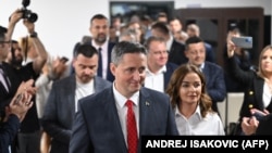 Denis Becirovic of the Social Democratic Party arrives to address the media and supporters in Sarajevo after Bosnia-Herzegovina's general election on October 2.