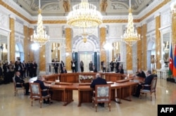 Kyrgyz President Sadyr Japarov was a no-show at a meeting with Russian President Vladimir Putin (second right) and other leaders in St. Petersburg on October 7.