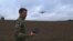 Instructor Ilya Trokhin demonstrates the controls of an unmanned aircraft at the Kruk drone school in Kyiv. 