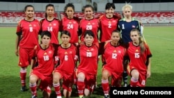 Aidana Otorbaeva (pictured wearing the number six) poses with the Krygyz national soccer team in 2013. She went to establish a national soccer academy for girls and become deputy chair of the national women's soccer association.