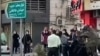 Iranian female protesters are manhandled by security forces at a demonstration in October in the city of Rasht, in Iran's northern Gilan Province, whose governor has now been added to an EU sanctions list. 