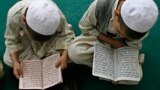 Young boys study at a madrasah in Afghanistan.
