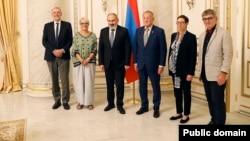Armenian Prime Minister Nikol Pashinian (third from left) meets with French senators in Yerevan on September 28.