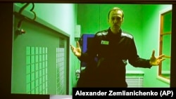Aleksei Navalny appears on a video link from prison for his trial in Moscow in October 2022.