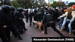 Russian police detain a protester during a rally against a mobilization announced in September.