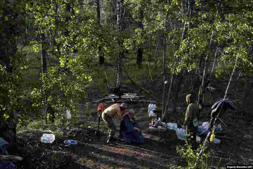 A Ukrainian soldier gets a haircut in a forest in the recently recaptured town of Lyman.&nbsp;The liberation of that key city is considered a major defeat for Russian forces.