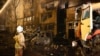 Из-за падения самолета на жилой сектор в Ейске погибли 15 человек. На фото: пожарные на месте трагедии, 17 октября 2022 года
