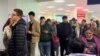 Russians line up to receive Kazakh personal identification numbers at a public service center in Aktobe, Kazakhstan, on September 28, 2022.