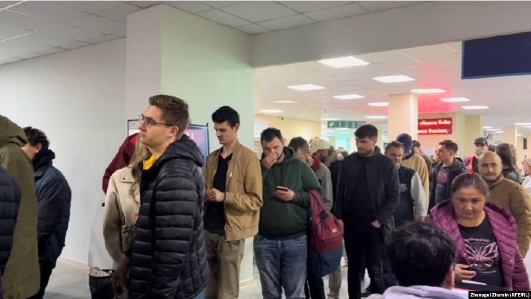 Russians line up for a Kazakh personal identification number at a public service center in Aqtobe in September.