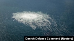 A photo taken from a Danish fighter jet on September 27 shows a gas leak from the Nord Stream 2 pipeline in the Baltic Sea.