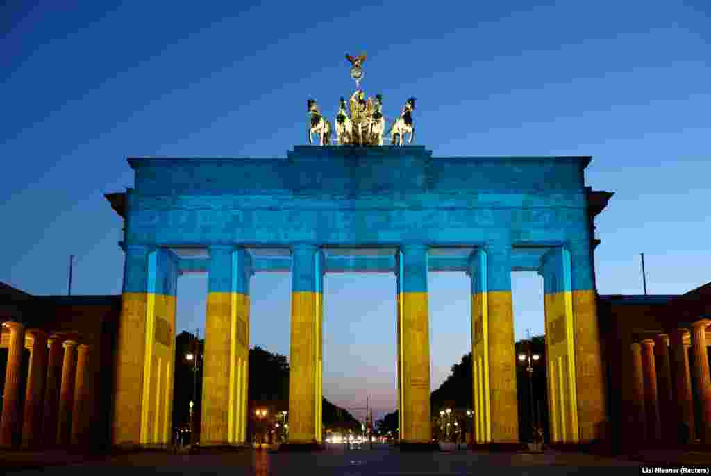 The Brandenburg Gate in Berlin, Germany, lit up in Ukrainian colors on May 9.&nbsp;