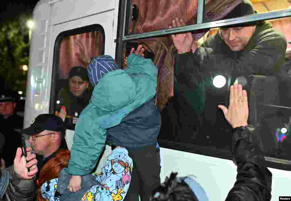 People bid farewell to draftees in the Siberian settlement of Bolsherechye in Russia&#39;s Omsk region on September 25.