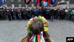 Pro-European demonstrators block the entrance to a government building in Kyiv on December 5.