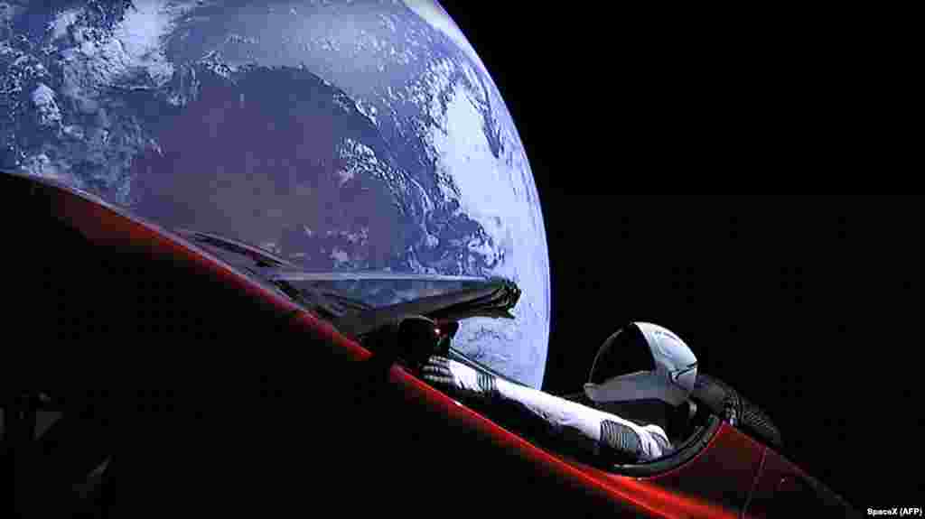 "Starman" sits in SpaceX CEO Elon Musk's cherry red Tesla roadster after the Falcon Heavy rocket delivered it into orbit around the Earth on February 6. Screams and cheers erupted at Cape Canaveral, Florida, as the massive rocket fired its 27 engines and rumbled into the blue sky over the same NASA launchpad that served as a base for the U.S. missions to the moon four decades ago. (AFP/SpaceX)