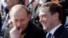 Dmitry Medvedev (right), president at the time, and then-Prime Minister Vladimir Putin enjoy a Victory Day military parade on Moscow's Red Square in 2008.