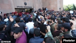 Armenian police prevented protesters from entering the mayor's building on May 11 before they blocked access.