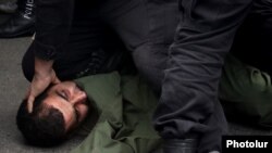 Armenia - Riot police arrest an opposition protester in Yerevan, May 10, 2022.