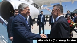 Turkish Vice President Fuat Oktay (right) greets Kazakh President Qasym-Zhomart Toqaev in Ankara on May 10.