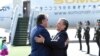 Tajik President Emomali Rahmon being greeted by Uzbek counterpart Shavkat Mirziyoev in Tashkent on a state visit on August 17.