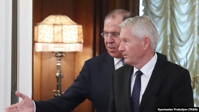 Russian Foreign Minister Sergei Lavrov (behind) welcomes Thorbjorn Jagland, secretary-general of the Council of Europe, during a meeting in Moscow on October 20.