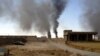 Smoke rises from Iraq's Baiji oil refinery during clashes between Islamic State fighters and Iraqi forces in late July. (file photo)