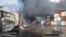 Containers burn on April 27 at the site of a massive explosion and fire that rocked a port near the southern port city of Bandar Abbas, Iran.
