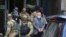 KOSOVO -- Hysni Gucati, the head of the War Veterans Organization of the Kosovo Liberation Army, is escorted by European Union security police officers, from the offices of a war veterans association in Kosovo, in Pristina, September 25, 2020