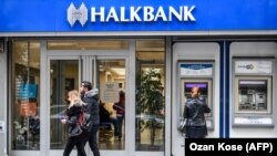 TURKEY -- People walk past a branch of Halkbank in Istanbul, December 1, 2017