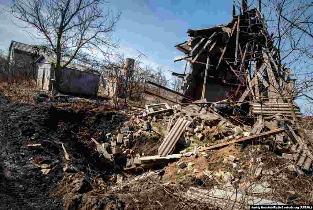 The remains of a dacha destroyed by a direct hit from a 152-mm artillery shell.&nbsp;