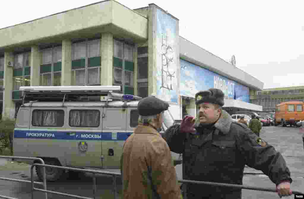 Security officers keep the area cordoned off. 