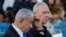 Israeli Prime Minister Benjamin Netanyahu (left) and Defense Minister Yoav Gallant attend a military ceremony at an army base on October 31.